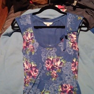 Nwot flowered top with side ruching sheer blue material on upper back of top.